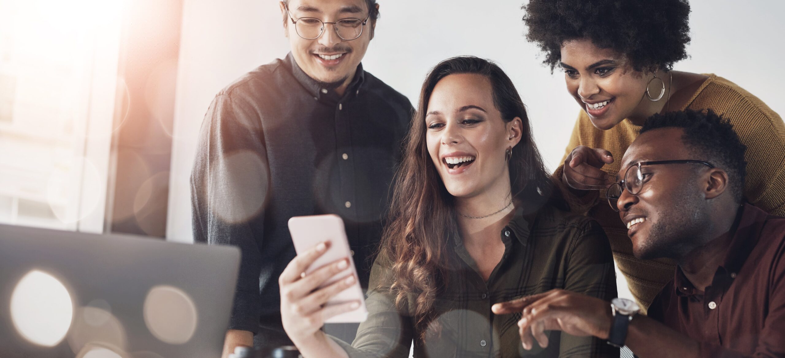 business-people-team-laughing-phone-office-with-social-media-meme-funny-marketing-email-break-professional-employees-collaboration-mobile-app-with-corporate-joke-browsing-1-min-scaled.jpg